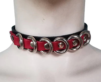 CHOKER WITH RED STRAPS AND MULTIPLE O RINGS